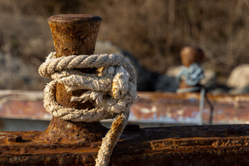 Rope on a rusty boat in the sunlight