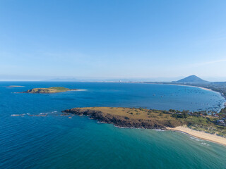 Obraz premium Aerial view of Bai Xep beach in Phu Yen province, Vietnam. Tropical coast from cliff above. Vietnam travel destination, golden sand beach waving sea rock boulders.