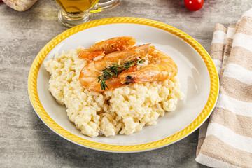Italian risotto with prawn served thyme