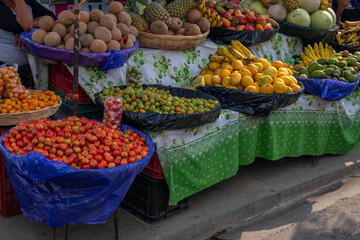 Stand with many different tropical fruits and vegetables on the street of a small tourist town in El Salvador, Ruta de las Flores.