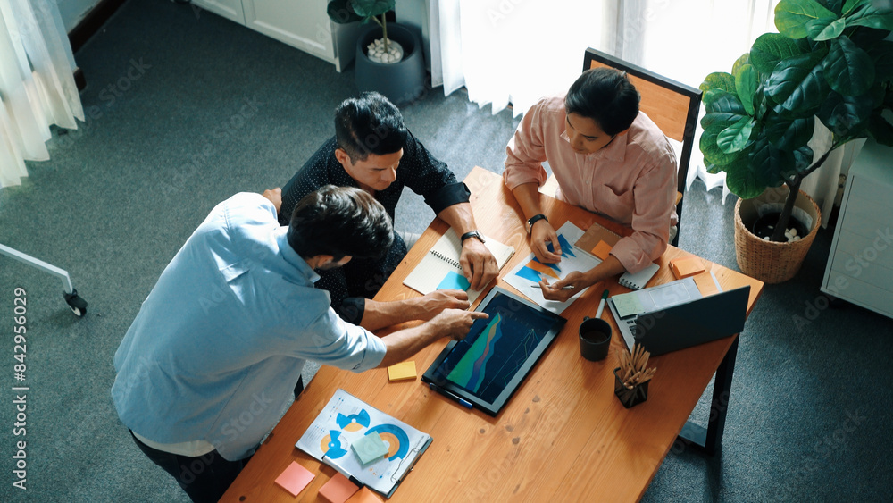Poster group of diverse people sharing idea while writing at sticky notes. professional smart business team