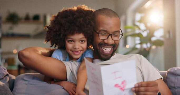 Happy dad, child and reading letter with love on sofa for fathers day, gift or surprise at home. Dada with smile for note, present or gesture on living room couch with son, little boy or kid at house