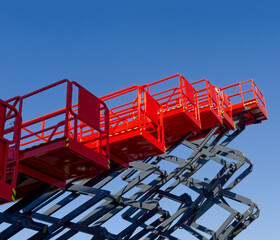 Group of red scissor lifts