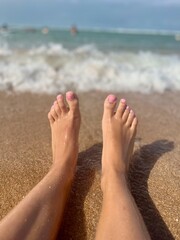 feet of a woman on a Caribbean beach