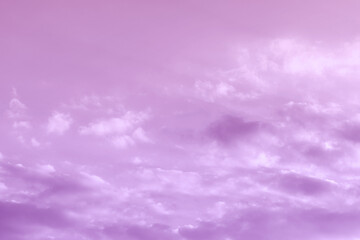 Purple violet sky with white clouds. Cloudscape background. Fresh multi colours sky.	