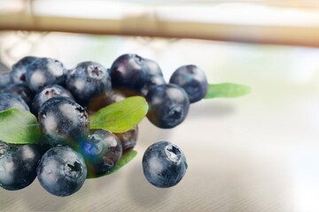 ripe sweet tasty blueberry on the desk