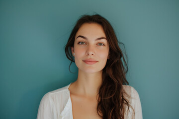 Fototapeta premium A close up portrait of a young woman with a subtle smile