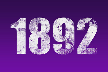 flat white grunge number of 1892 on purple background.	