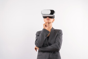 Businesswoman thinking about marketing plan while wearing VR glasses at white background. Manager...