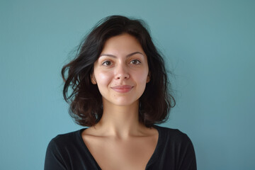 Fototapeta premium A close up portrait of a young woman with a subtle smile