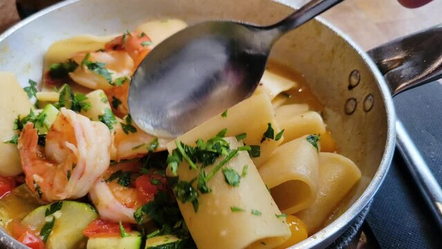 the essence of coastal Italian cuisine with this gourmet Paccheri al Profumo di Mare. Each tube-shaped pasta is filled with the freshest shrimp, complemented by ripe cherry tomatoes and aromatic herbs