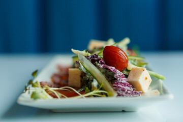 Salad with herbs hard cheese black olives cherry tomatoes onion cucumber