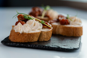 Canapes with sun-dried tomato and salami