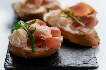 Canapes with sun-dried tomato and salami