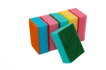 Multi-colored cleaning sponges on a white background