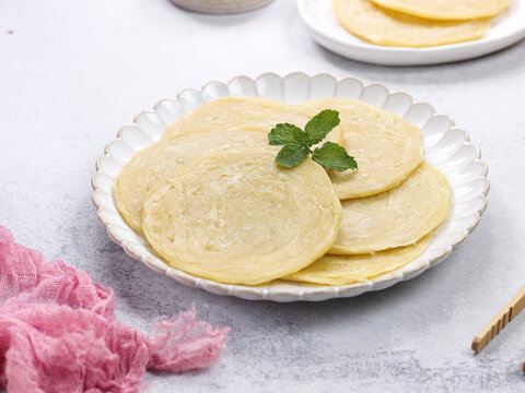 raw of roti canai or paratha (Parotta) flat bread, or also known as roti maryam in indonesia. Frozen food. usually sell in frozen food store