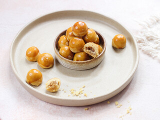 Nastar Cookies, Pineapple tarts or nanas tart are small, bite-size pastries filled or topped with pineapple jam, commonly found when Hari Raya or Eid Al Fitr or Lebaran. Selective focus