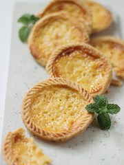 Cake of pie. Custard tarts or Pie Susu on marble board . selective focus with shiny and rough rexture