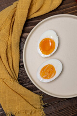 Soft-boiled and hard-boiled eggs on a plate