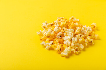 Tasty popcorn in color background. Cinema and entertainment concept. Movie night with...