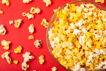 Tasty popcorn in color background. Cinema and entertainment concept. Movie night with popcorn.Cheese and caramel popcorn. Delicious appetizer, snack. Place for text. Copy space.Banner