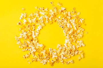 Tasty popcorn in color background. Cinema and entertainment concept. Movie night with...