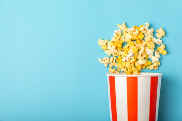 Popcorn box. Red and white striped buckets of popcorn on a blue background. Cinema and...