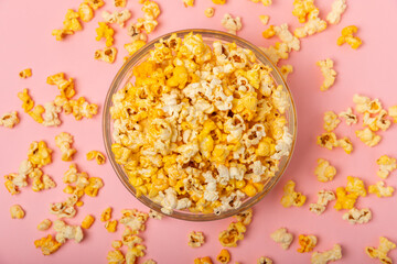 Tasty popcorn in color background. Cinema and entertainment concept. Movie night with popcorn.Cheese and caramel popcorn. Delicious appetizer, snack. Place for text. Copy space.Banner