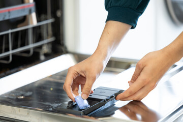putting the bar of soap in the dishwasher to turn it on