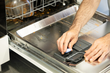 putting the bar of soap in the dishwasher to turn it on