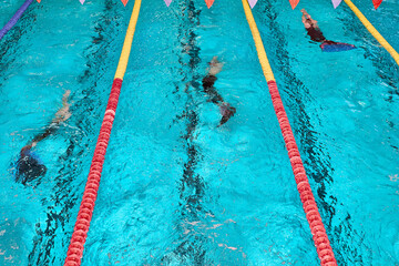 Finswimming World Championships. Aquatics monofin underwater sports. Athletes competing in blue...