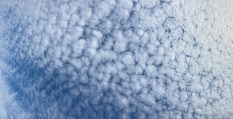 Blue sky texture with some white clouds on it