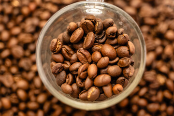 Coffee Beans Overflowing in Transparent Mug