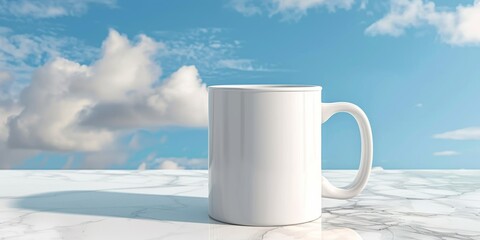 Obraz premium White mug on marble surface with blue sky background
