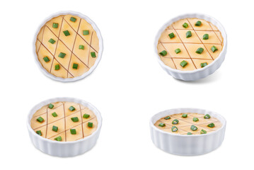 Asian steamed eggs in a bowl with soy sauce and scallions on a white isolated background