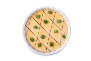 Asian steamed eggs in a bowl with soy sauce and scallions on a white isolated background