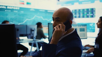 Chief executive officer presenting performance metrics numbers to shareholder on phone call,...