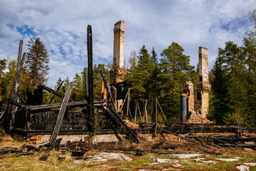 Completely burnt wooden rural house. Consequences of fire, war, ect.