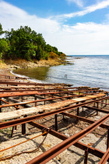 Fototapeta premium Empty, old and rusty slipways of the Fisherman's bay in the village of Varvara, Tsarevo Municipality, Burgas Province, Bulgarian Black Sea coast