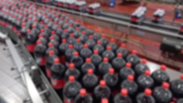 soda factory Beverage manufacturing process. intentional blur.