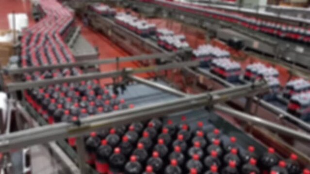 soda factory Beverage manufacturing process. intentional blur.