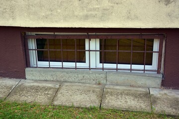 Barred window of the basement building