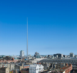 Dublin, Ireland cityscape from the air. Bright sunny day with blue sky and the Spire towering over the city.