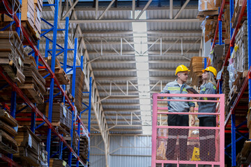 workers man and woman using a hydraulic scissor lift to check stock near the shelves warehouse. industry factory warehouse. Worker Screening Package In Warehouse.