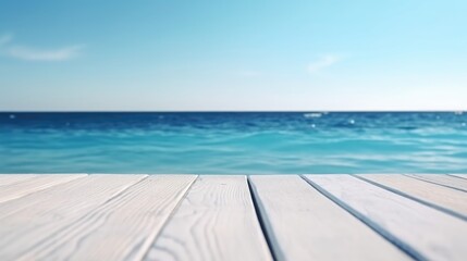 Fototapeta premium Seaside Serenity: A pristine wooden surface frames the captivating panorama of a tranquil blue ocean and clear sky. Evoking a sense of calm and peace. 