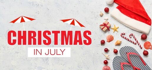 Santa's hat, flip-flops and shells with Christmas decor on light background. Christmas in July