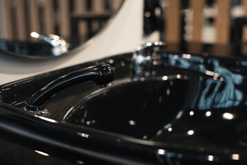 Barber spray bottle, brush and accessory on dressing table in barber shop