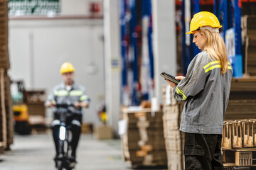 man riding electric bicycle and checking stock items for shipping. male inspecting the store factory. Logistics employees holding folders at on site warehouse area for shipping transportation.