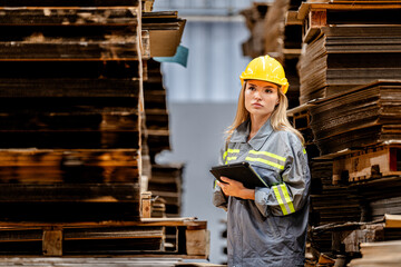 woman worker walking and checking stock items for shipping. Female inspecting the store factory....