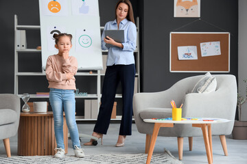 Sad little girl at psychologist's office
